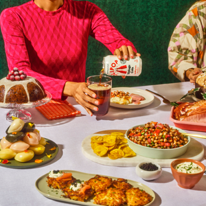 Photograph of people enjoying a holiday feast with OLIPOP