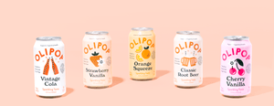A variety of different OLIPOP soda cans